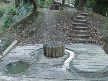 Wooden art feature with water